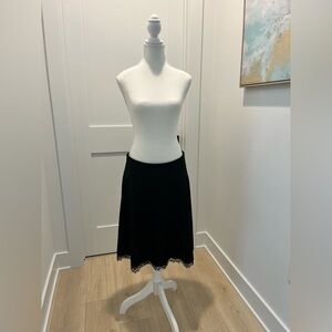 Vintage The limited black A-line skirt with lace trimmed hem size 6 feminine